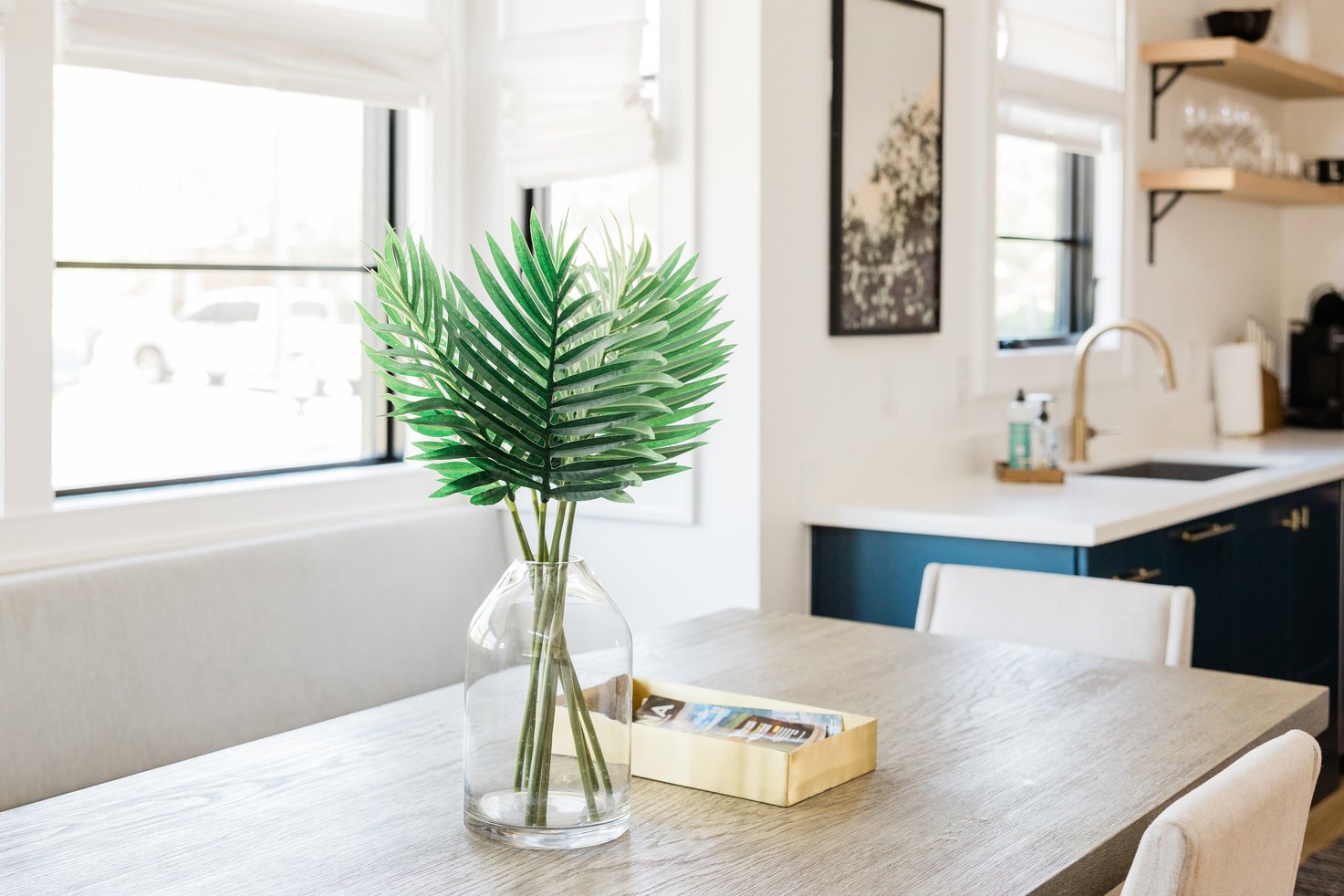 Box and Vase with Plant on the Table